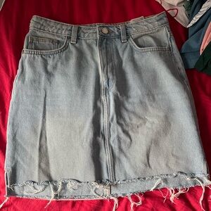 100% cotton raw hem light wash denim mini skirt